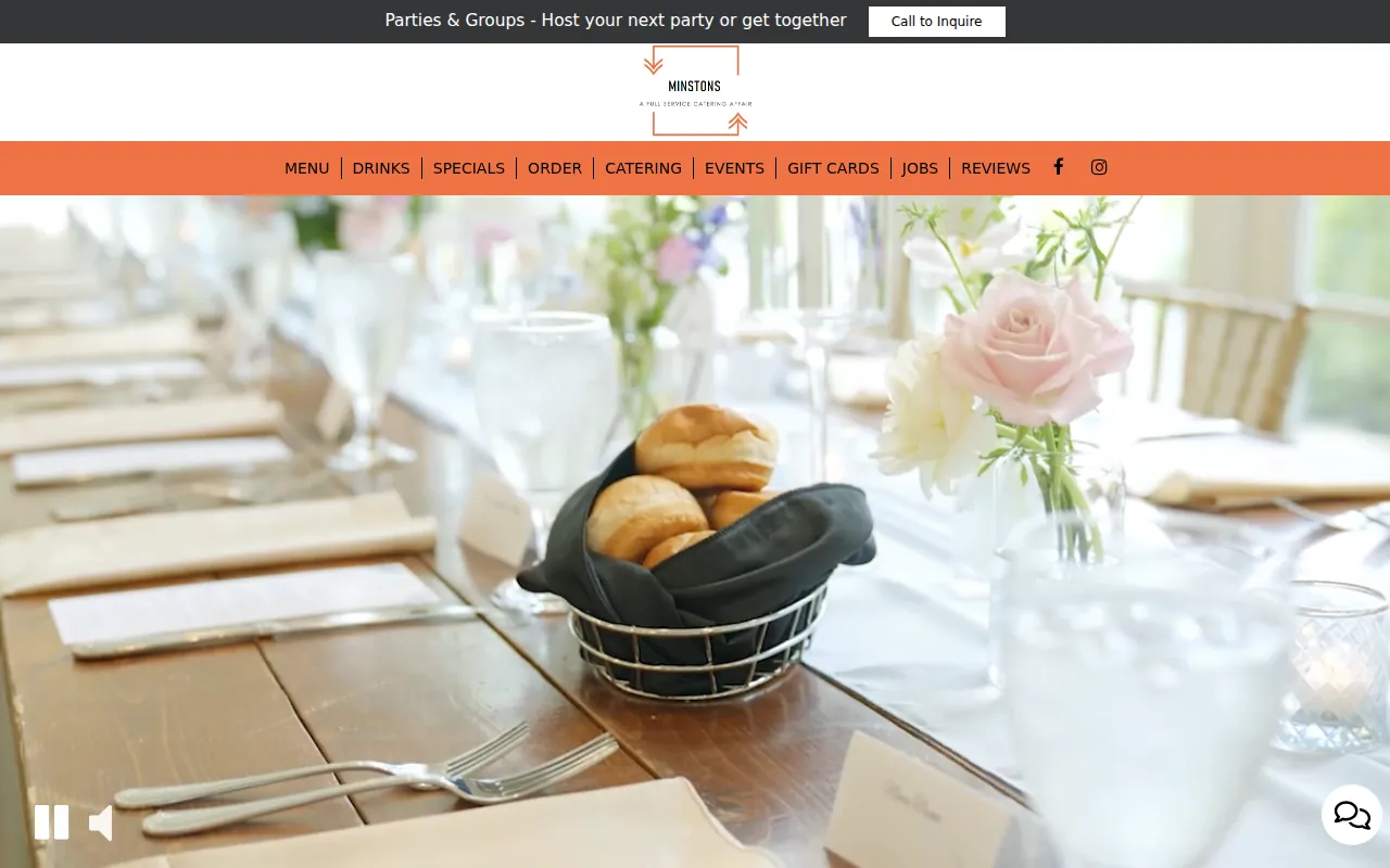 Minston's Catering on its old SpotHopper website: the same SpotHopper template's announcement bar, centered logo, bar of menu links split by lines, full-width video and chat bubble, in orange